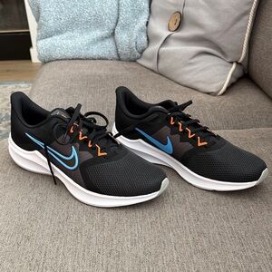 Nike Men's Black Athletic Shoes with Blue and Orange Accents